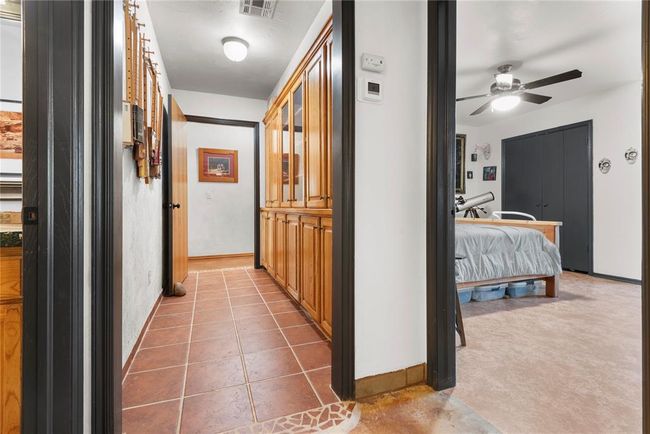 Hallway featuring visible vents and baseboards | Image 20