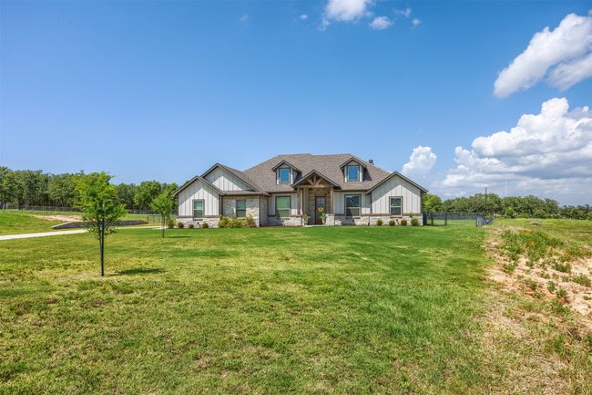 Country living at its best. Enjoy this move in ready home and FENCED lot. The 3 car garage is large enough for your cars and your toys! The lot is ready for play. Lovely grass and fence will be loved by the humans and the furry animals! | Image 32