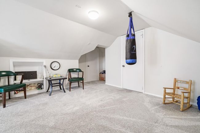 Sitting room featuring lofted ceiling, baseboards, and carpet flooring | Image 23