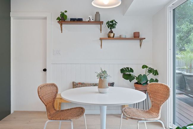 Dining area featuring a wainscoted wall and wood finished floors | Image 8