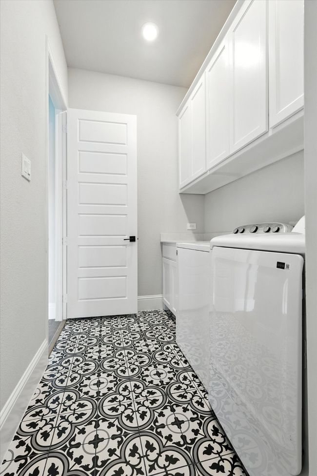 Laundry area with cabinet space, independent washer and dryer, and recessed lighting | Image 20