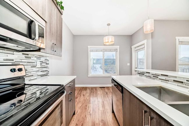 23 Baysprings Way Sw, Home with 3 bedrooms, 3 bathrooms and 1 parking in Airdrie AB | Image 18