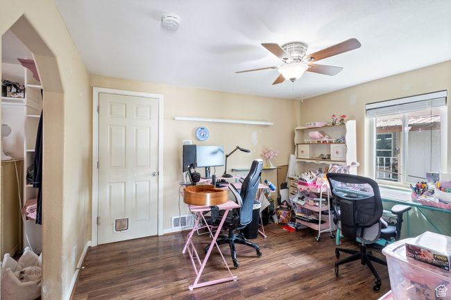Office featuring visible vents, baseboards, a ceiling fan, and wood finished floors | Image 13