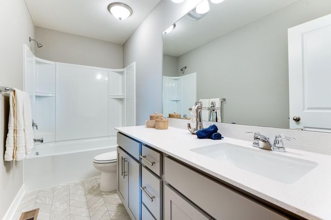 Those bedrooms are serviced by this full bath! Photo of model home, color and options will vary. | Image 32
