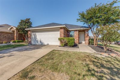 Single story home with a front lawn and a garage | Image 2