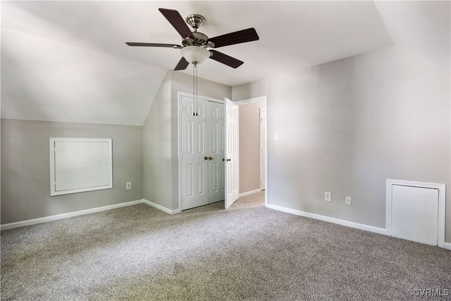 3rd bedroom with ceiling fan, carpet flooring, and vaulted ceiling | Image 20
