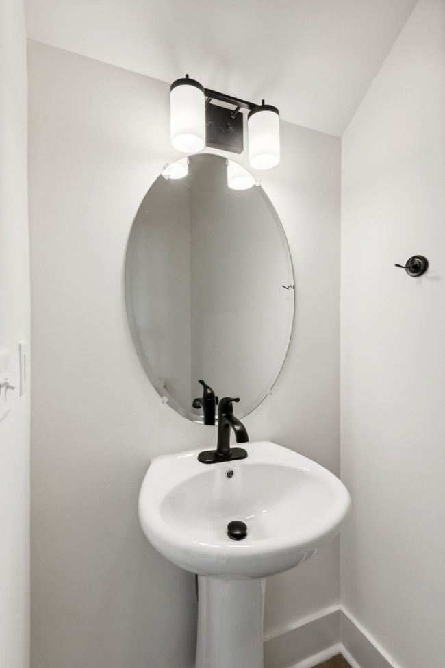 Beautiful matte black fixtures provide a clean, modern contrast to the white aesthetic, and it looks GREAT! Actual photo of home. | Image 17