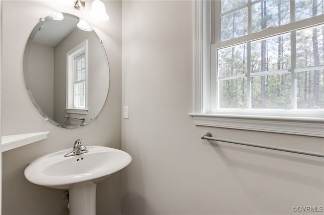 Bathroom featuring plenty of natural light and a sink | Image 14