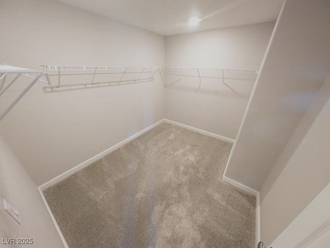 Spacious closet with carpet flooring | Image 25