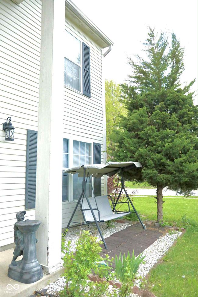 view of property exterior with a lawn | Image 5