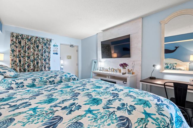 Bedroom with a textured ceiling | Image 7