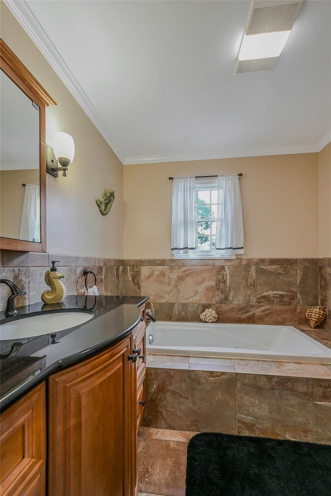 Huge Upgraded Full Bathroom featuring a Soaking Tub! | Image 26