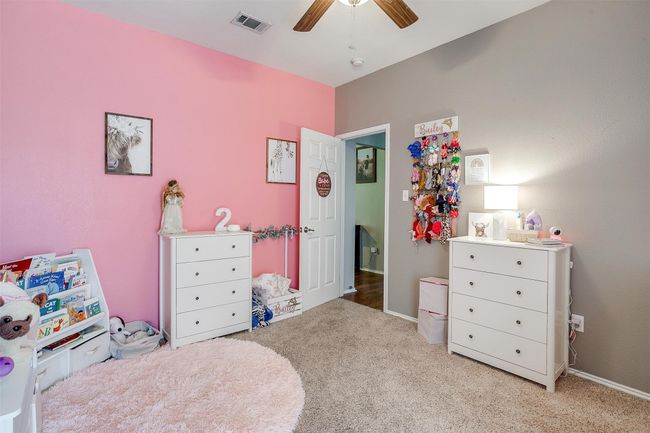 Carpeted bedroom with ceiling fan and baseboards | Image 33