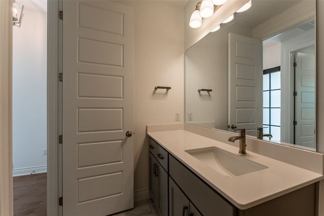 Bathroom with vanity and baseboards | Image 10
