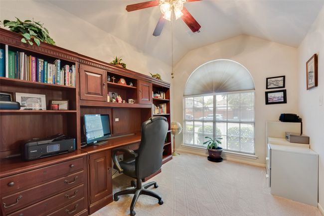 Dining space with light carpet, arched walkways, a chandelier, baseboards, and ornamental molding | Image 20