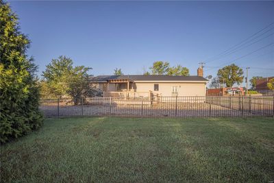 Rear view of property featuring a lawn | Image 3