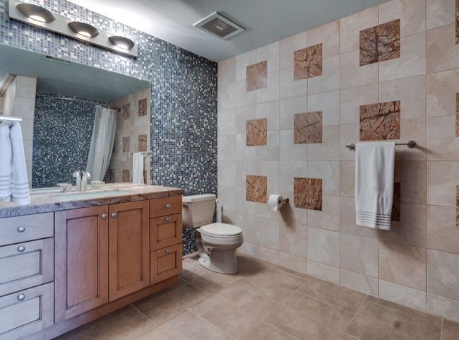 Bathroom #2 has beautiful tile designs with a tub shower combo. | Image 12