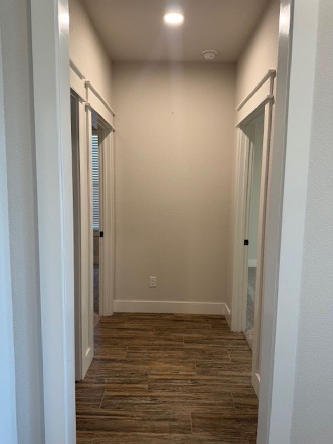 Corridor featuring dark wood-style floors and recessed lighting | Image 21