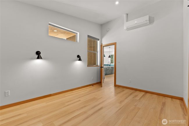 Primary bedroom off of kitchen. | Image 22