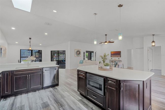 Stainless steel appliances, oversized island, stone counters, 42" cabinets | Image 12