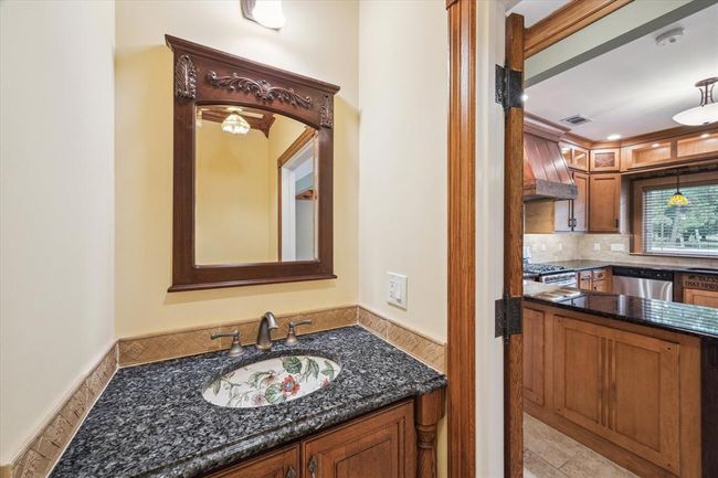 POWDER ROOM OFF OF THE KITCHEN IS CONVENIENTLY LOCATED | Image 22
