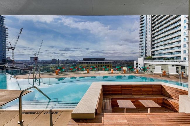 Community pool featuring fence and a patio area | Image 17