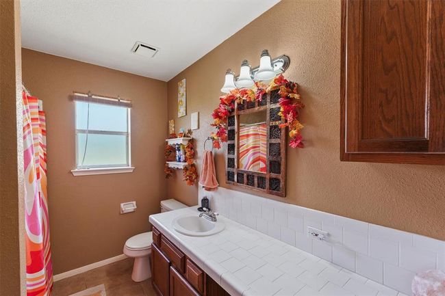 Full bathroom with great counter space and storage | Image 22