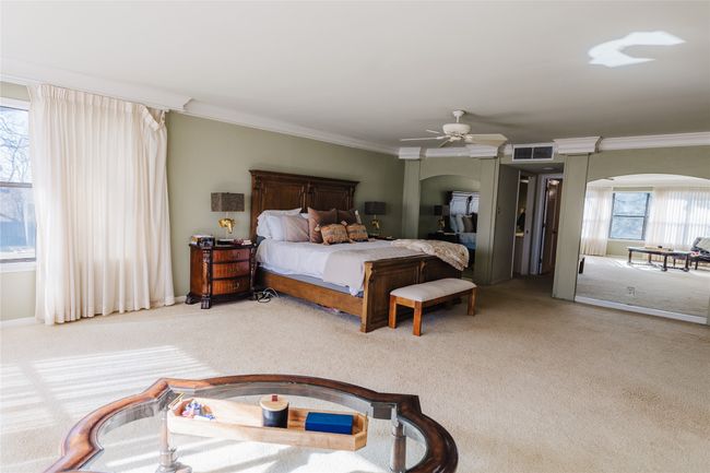 Carpeted bedroom featuring ceiling fan and ornamental molding | Image 28