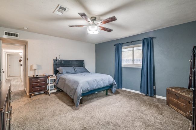 Bedroom featuring carpet and a ceiling fan | Image 17