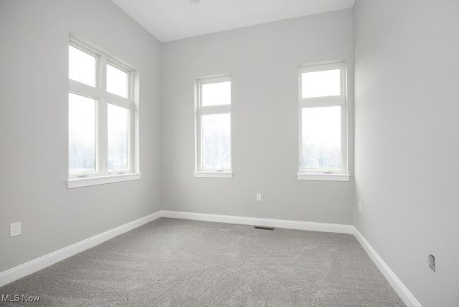 Unfurnished room with plenty of natural light and carpet flooring | Image 22