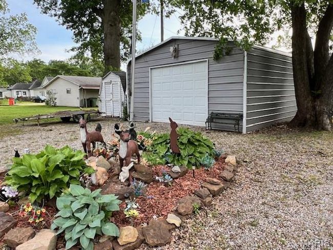 Detached garage behind home. | Image 22