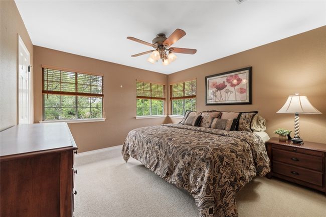 Secondary bedroom with corner windows, a light filled retreat. | Image 22