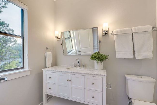 The room's ensuite bathroom includes a quartz vanity and a shower/tub combination. | Image 30