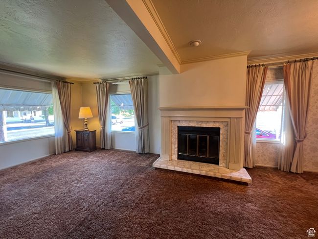 Fireplace, windows with exterior awnings | Image 11