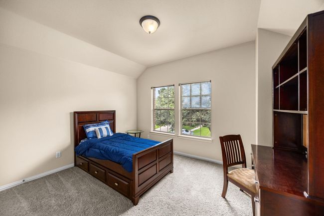 The third guest bedroom up stairs that is large, has beautiful views into the tree's and another large closet. | Image 32