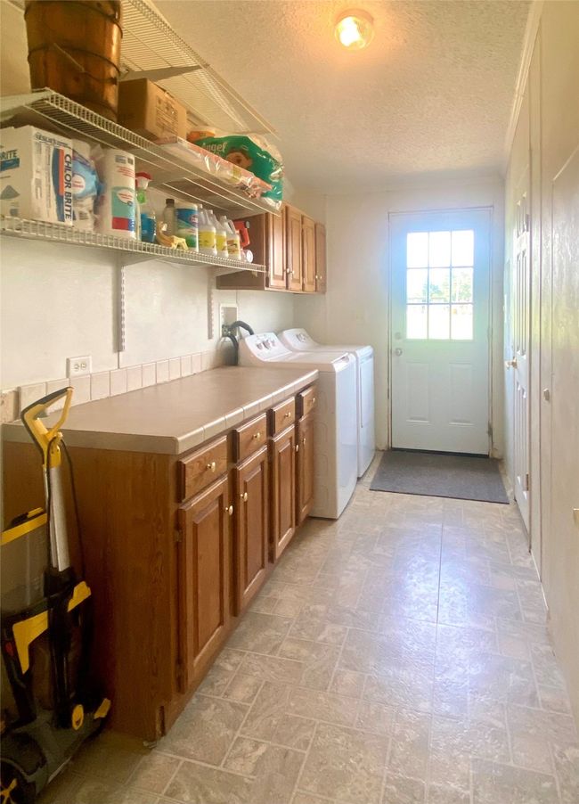 Laundry room with washer and dryer | Image 19