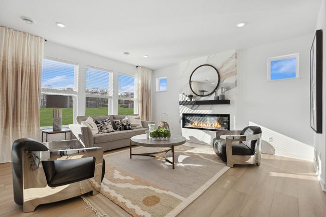 (Photo of a decorated model, actual homes finishes will vary) The spacious and open-concept main level allows for optimal versatility and comfort. | Image 6