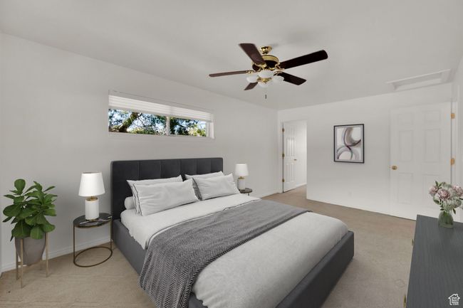 Bedroom with carpet flooring, attic access, a ceiling fan, and baseboards | Image 14