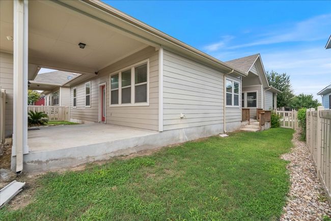 The covered back porch also leads you to the detached garage. | Image 31