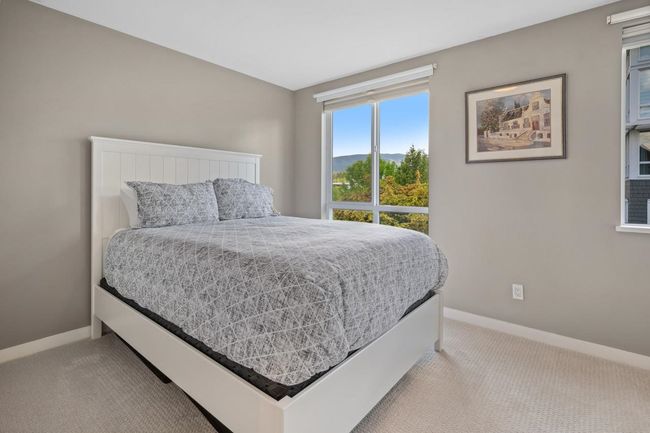 Bedroom with carpet and baseboards | Image 28