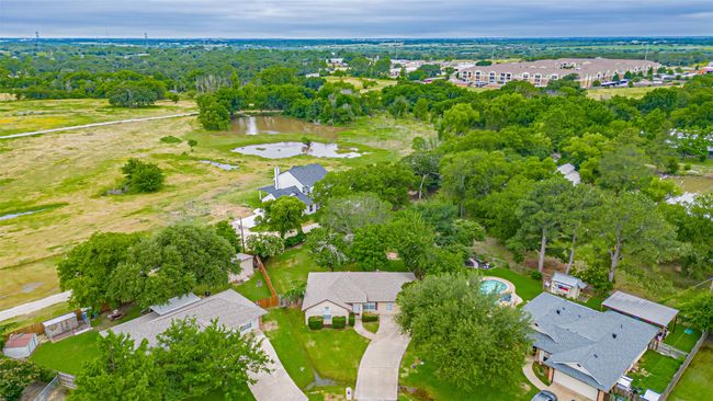 Aerial view of residential area featuring a large body of water | Image 22