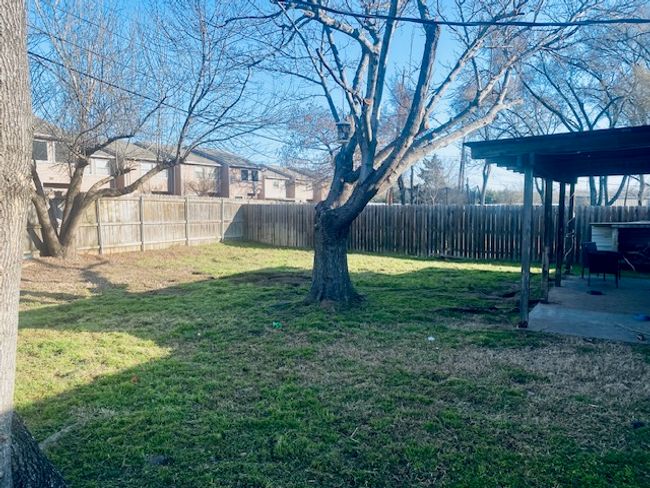 View of yard with a patio area and a fenced backyard | Image 18