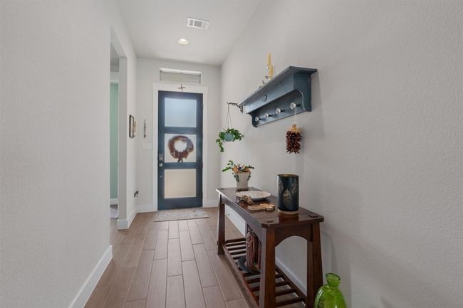Doorway with baseboards and wood finished floors | Image 4