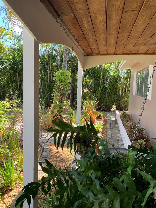 Front Porch with a Beautiful View of the Garden Island of Bromeliads! | Image 10