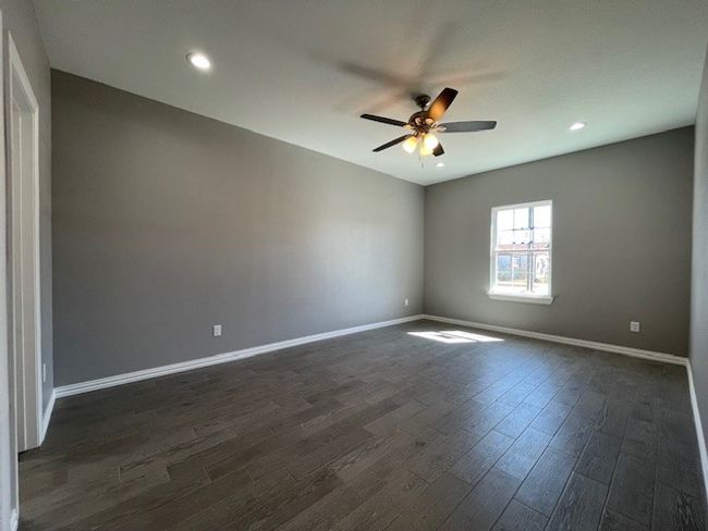 Master bedroom featuring wood-style floors, baseboards, a ceiling fan, and recessed lighting | Image 17