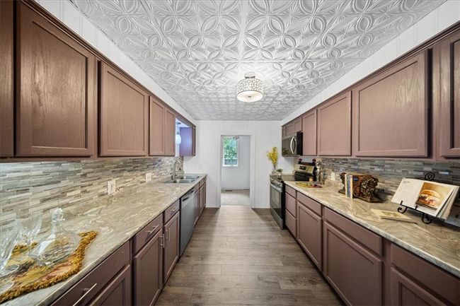 Laundry room off of kitchen | Image 12