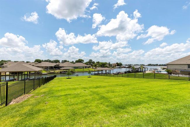 Expansive lakeside property on nearly half an acre, perfect for entertaining or relaxing. | Image 5