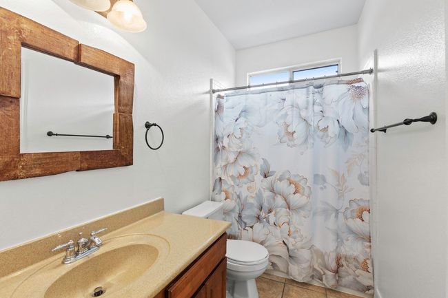 Bathroom upstairs with tub and shower | Image 25