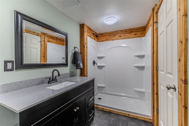 Bathroom featuring vanity and a shower | Image 24