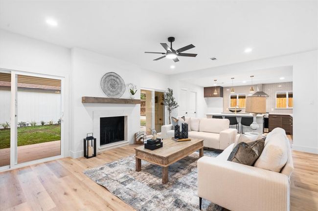 The Living area is an open space between the kitchen, dining area and the bedrooms, this is the center of the home! | Image 10